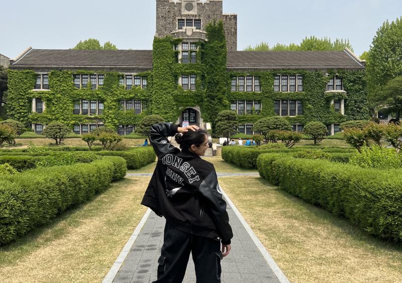 Aanandi posing in front of Yonsei University in Seoul, Korea